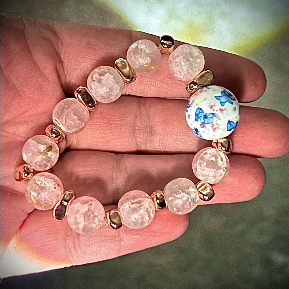 Elegant Stitch Gold and Blue Floral Beaded Bracelet with soft pink beads